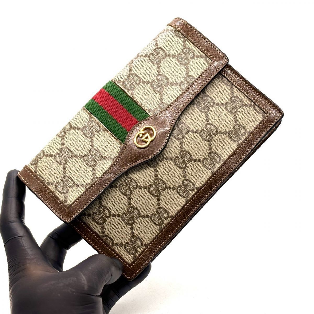 織り込まれた誇りの縞模様】 GUCCI 長財布 ポーチ GGスプリーム