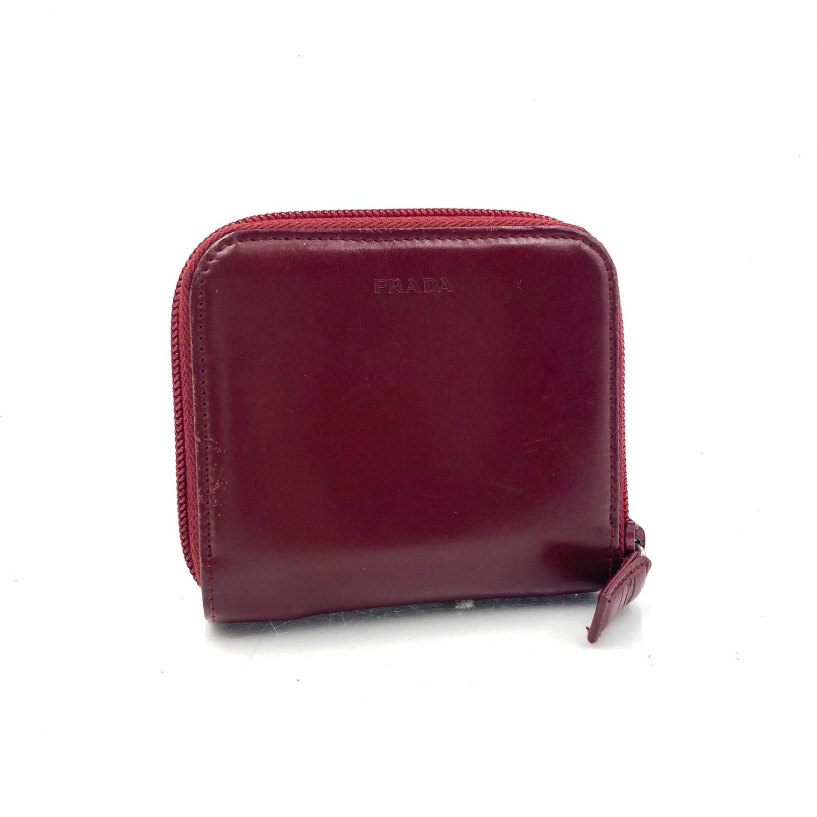 ■美品■PRADA プラダ ロゴ型押し　ジップアラウンド　二つ折りミニ財布　スムースレザー　本革　レッド系ボルドー　イタリア製　刻印あり　レディース