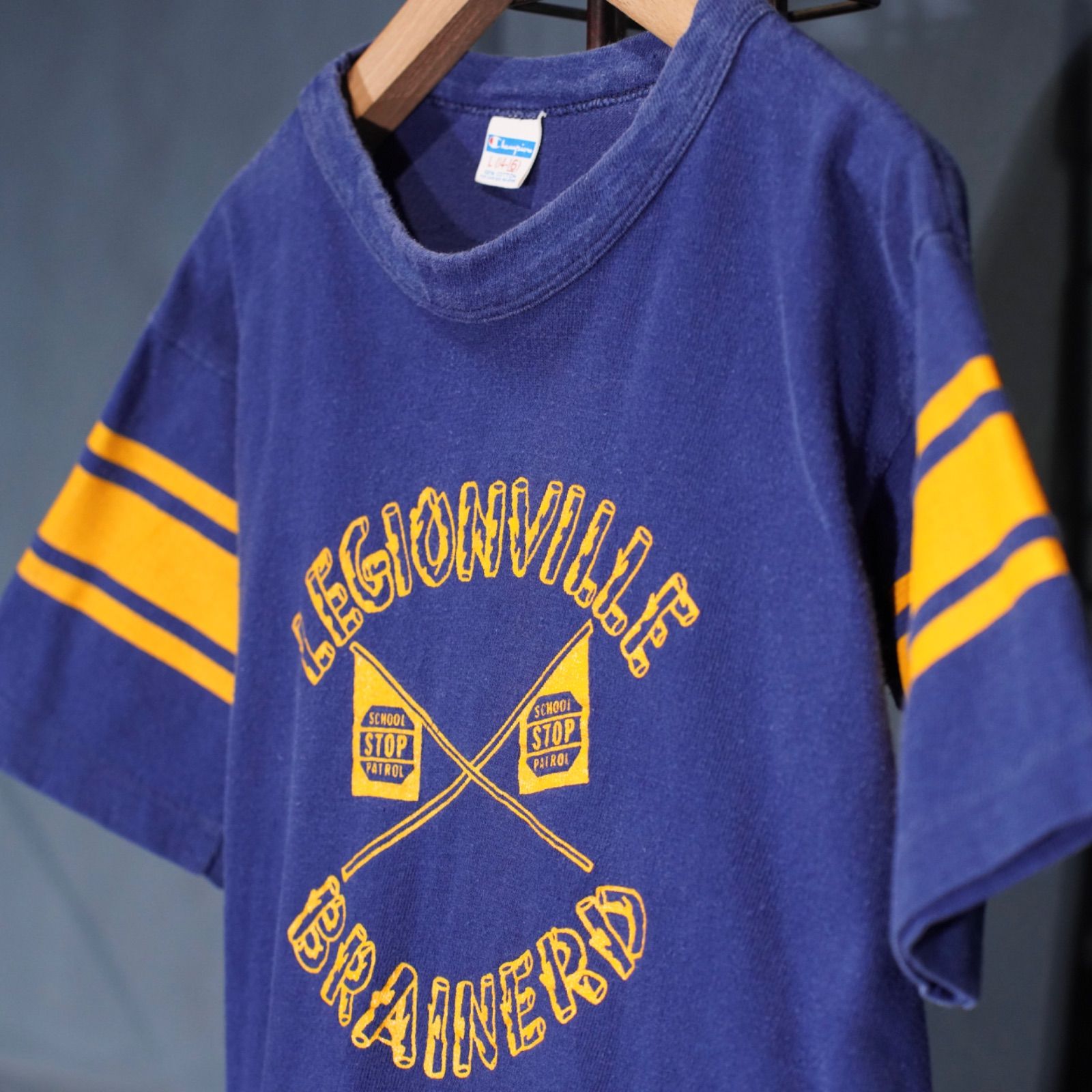 70's～80's USA VINTAGE champion LEGIONVILLE BRAINERD PRINT DESIGN FOOT BALL T SHIRT/70年代～80年代アメリカ古着チャンピオンバータグプリントデザインフットボールTシャツ