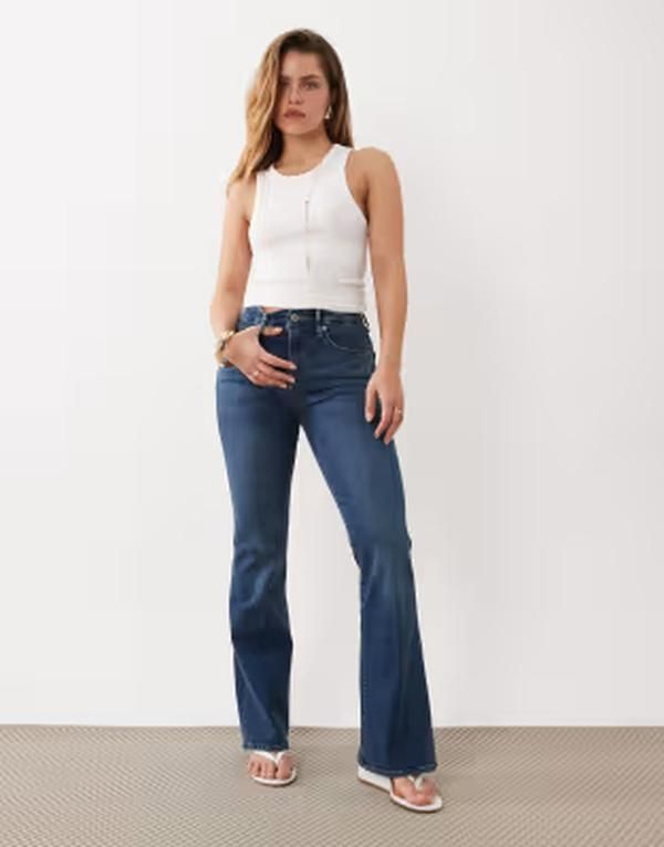 グッドアメリカン レディース ボトムス デニムパンツ プチ ジーンズ Good American Petite flare jeans in mid blue wash BLUE ブルー