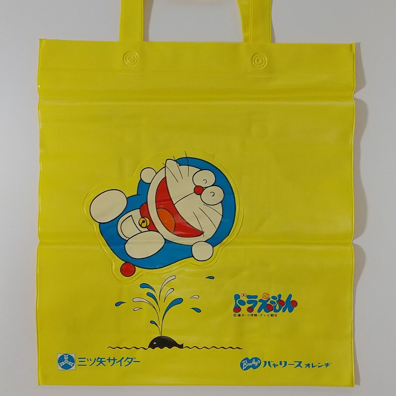ドラえもん 三ツ矢サイダービニールバック（イエロー） - メルカリ