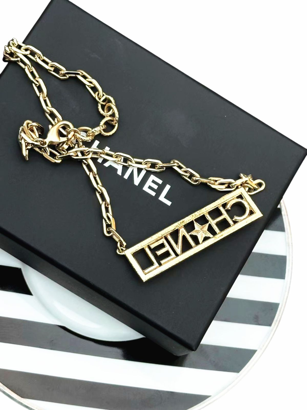 CHANELシャネルアルファベット星スターロゴペンダントラインストーンチェーンGPネックレスチョーカーネックレス刻印あり