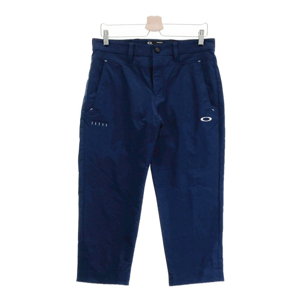 サイズ：32 OAKLEY オークリー 2023年モデル FOA405155 クロップドパンツ  ネイビー系 [240101333519] ゴルフウェア メンズ ストスト