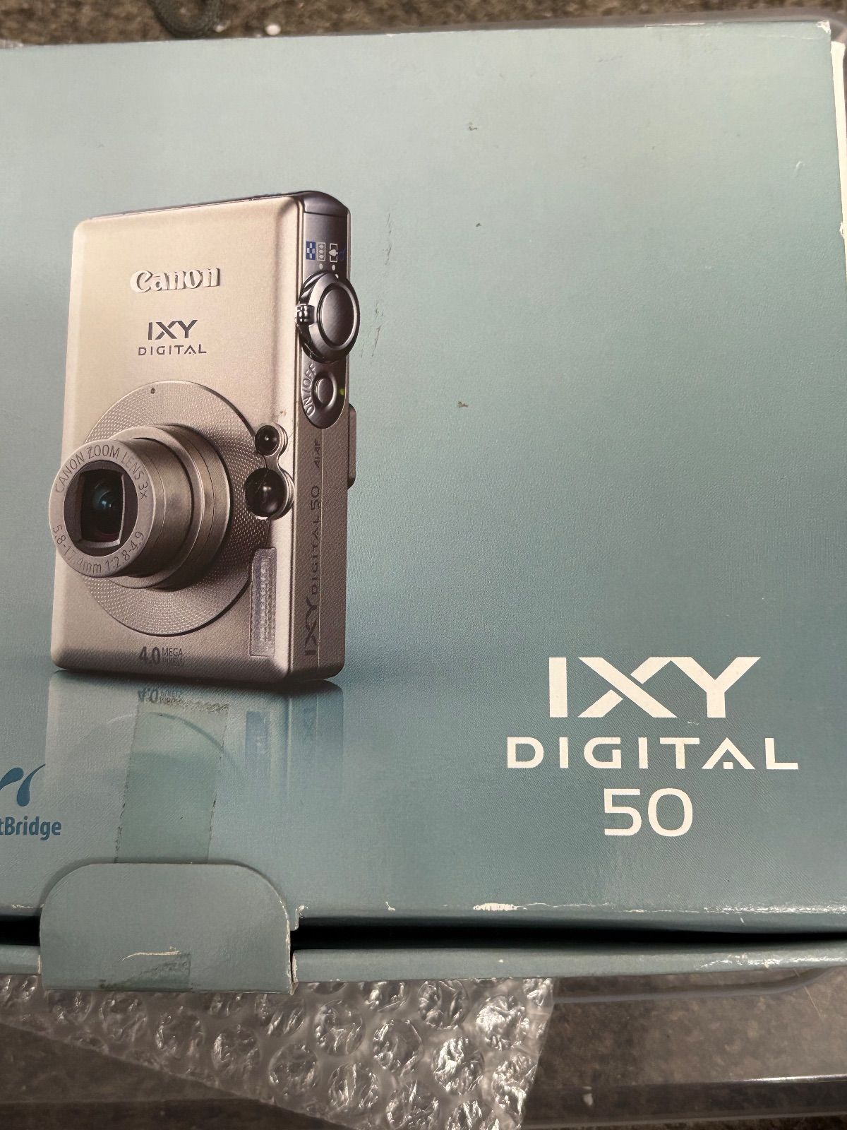 Canon IXY50 DIGITAL 50 961 File:Canon Digital Ixus 50 front.png