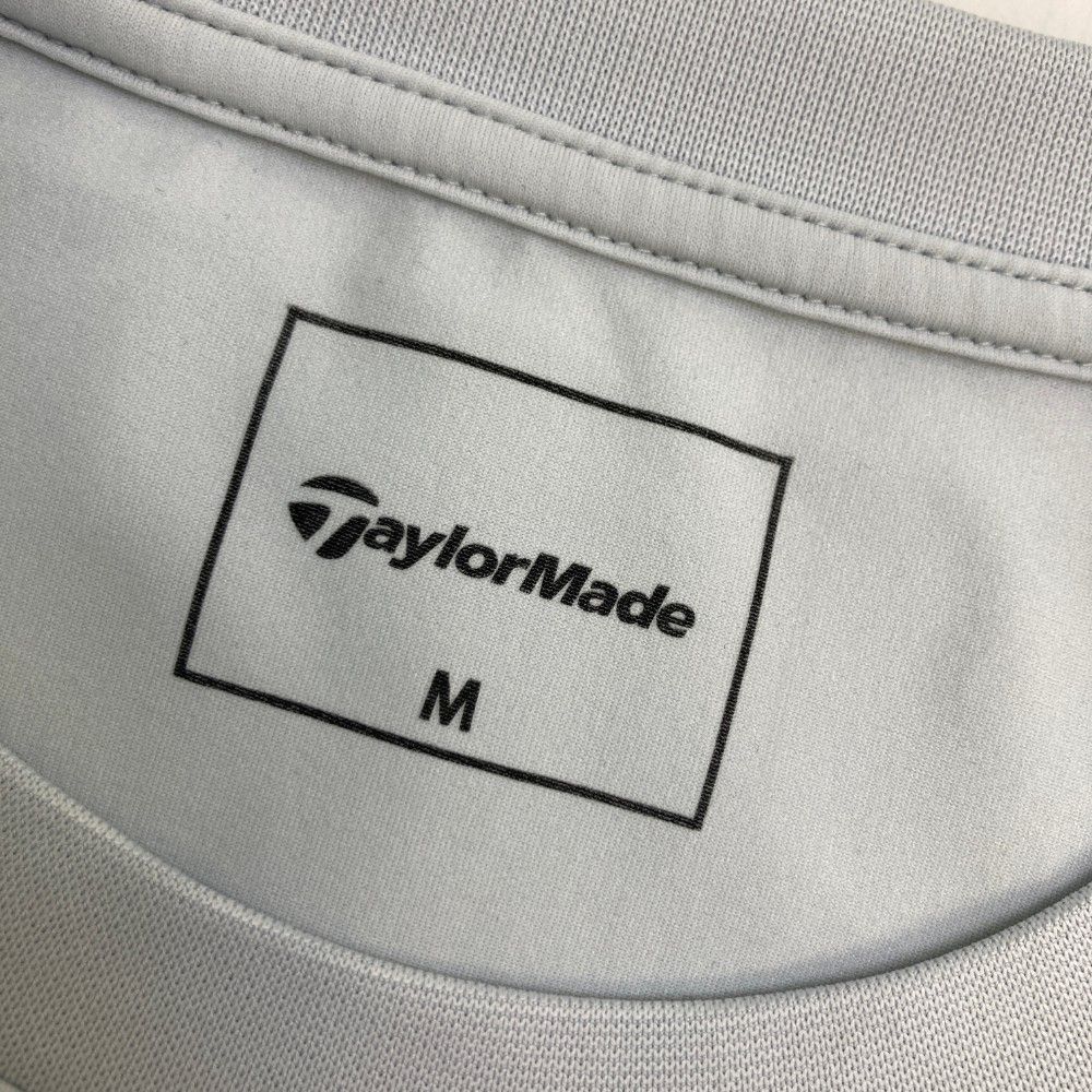 サイズ：M TAYLOR MADE テーラーメイド 2024年 半袖Tシャツ  ブラック系 [240101447307] ゴルフウェア メンズ ストスト サイズ：M TAYLOR MADE テーラーメイド 2024年 半袖Tシャツ