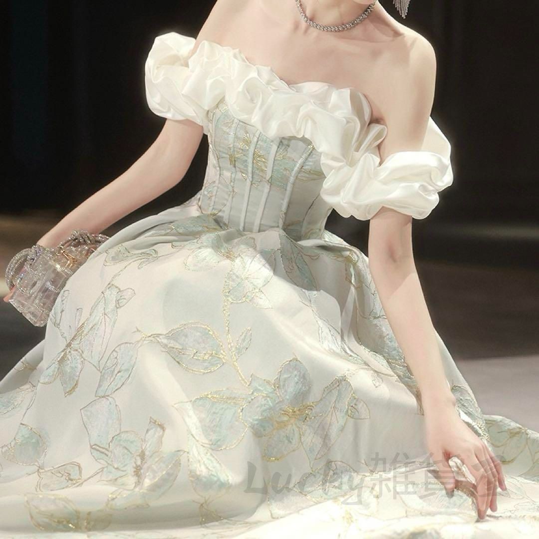 フリルのオフショルに花柄が上品なイブニングドレス - メルカリ フリルのオフショルに花柄が上品なイブニングドレス - メルカリ