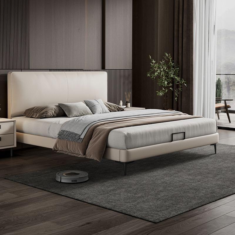 ミニマルな革張りの柔らかなベッド