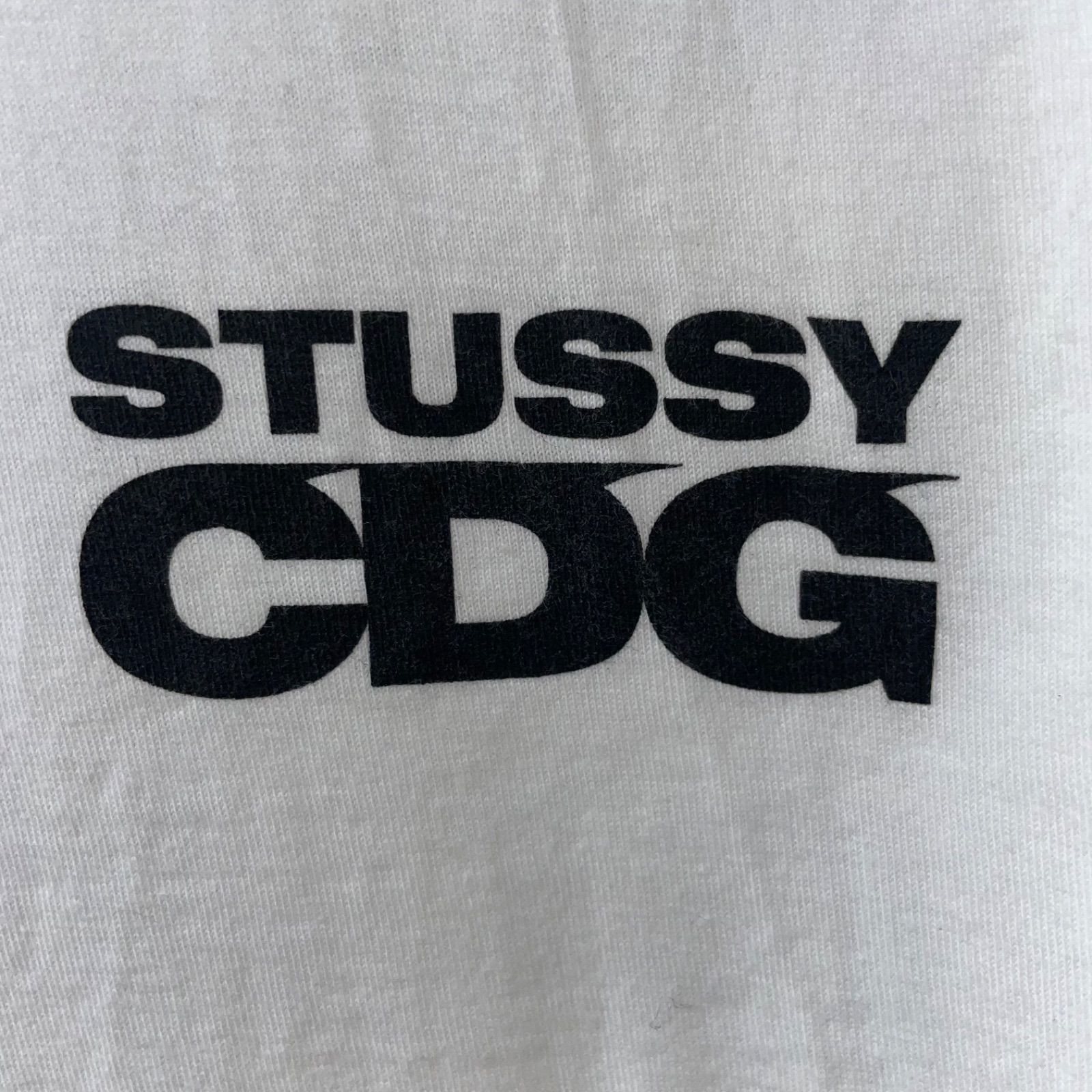 STUSSY CDG サーフマンTシャツ　Lサイズ