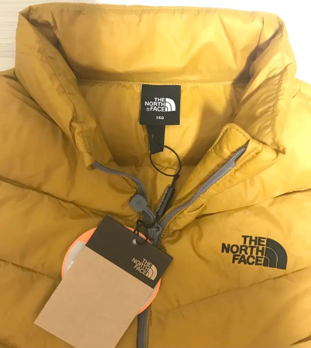 【 新入荷·数量限定】 正規品 THE NORTH FACE kids ザノースフェイスキッズ 軽量ダウンベスト 140 マスタード 上質