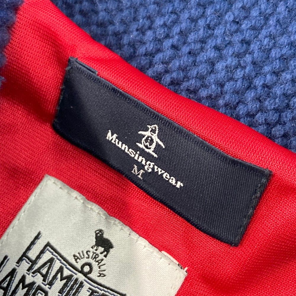 サイズ：M MUNSING WEAR マンシングウェア  裏地付き 長袖ニットジャケット ネイティブ 総柄 ネイビー系 [240101427890] ゴルフウェア メンズ ストスト サイズ：M MUNSING WEAR マンシングウェア 裏地付き 長袖ニット