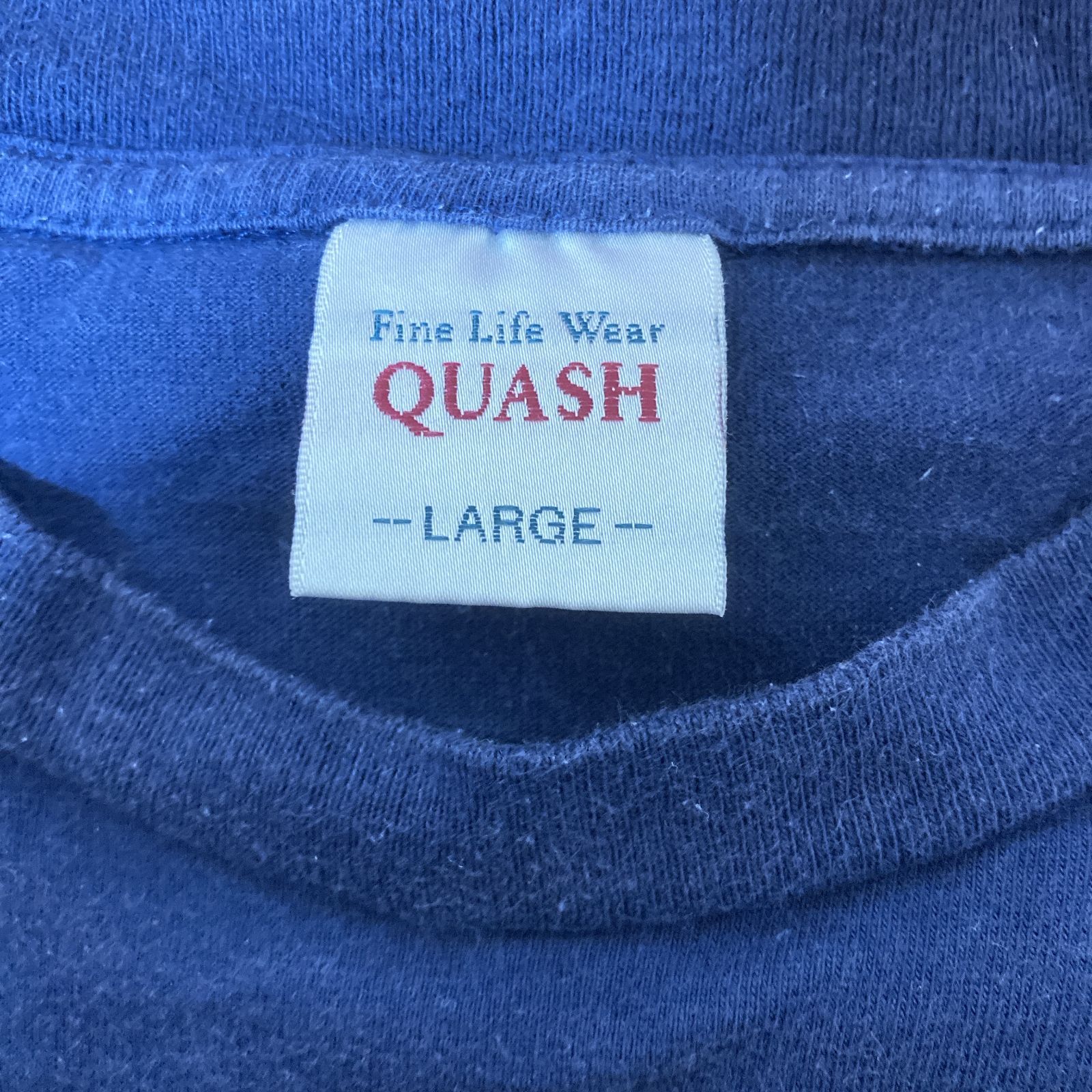 QUASH クアッシュ LARGE ブルー 英字プリント 半袖コットンTシャツ