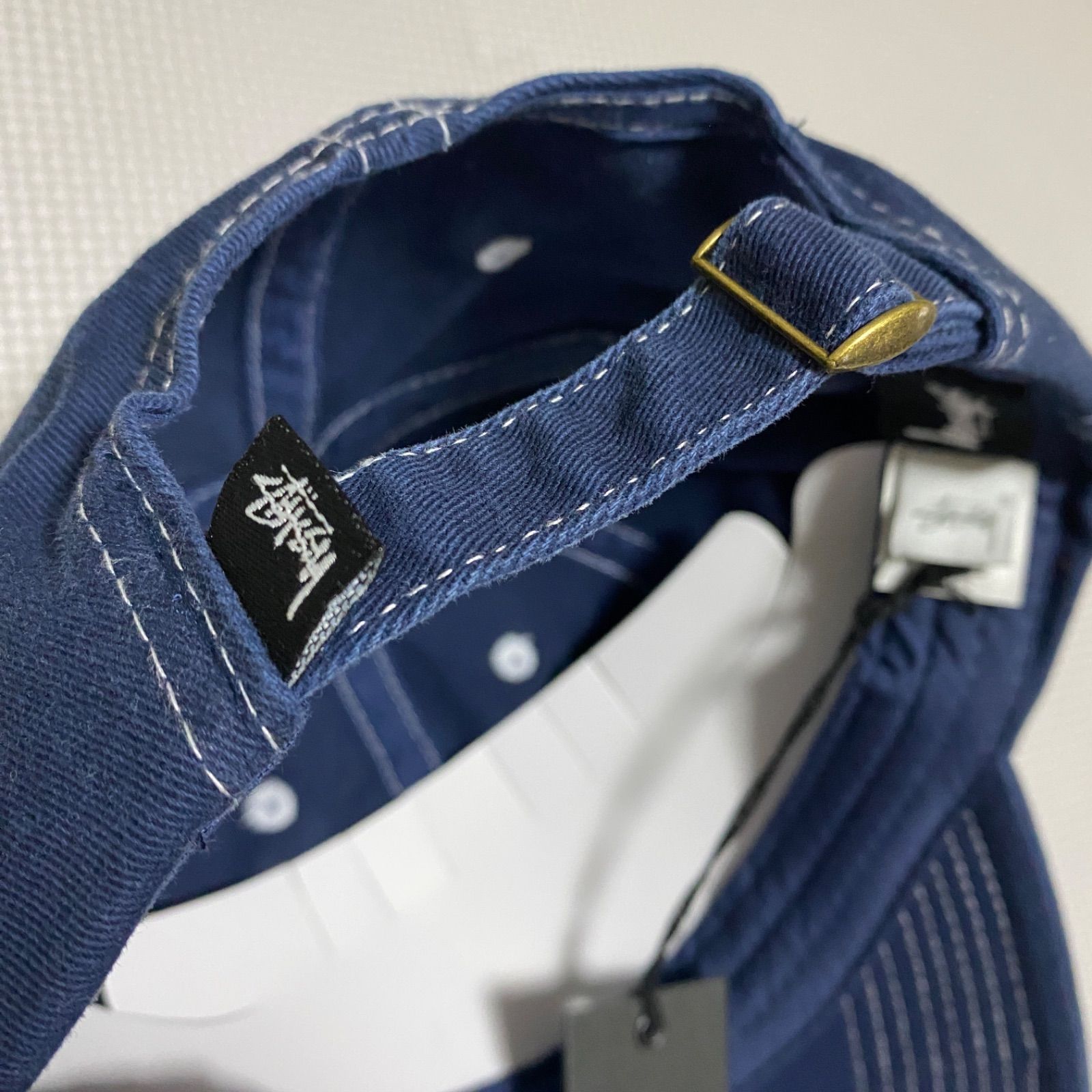 STUSSY ステューシー ベルトバック キャップ ネイビー STUSSY》ステューシー ワークギア パッチ ストラップバック