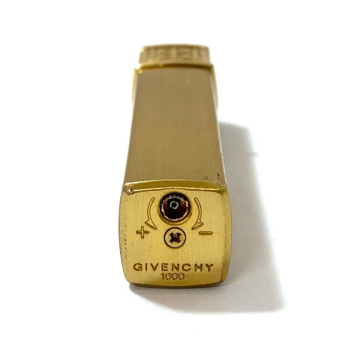 GIVENCHYのストライプデザインのブラウンとゴールドのガスライター9000