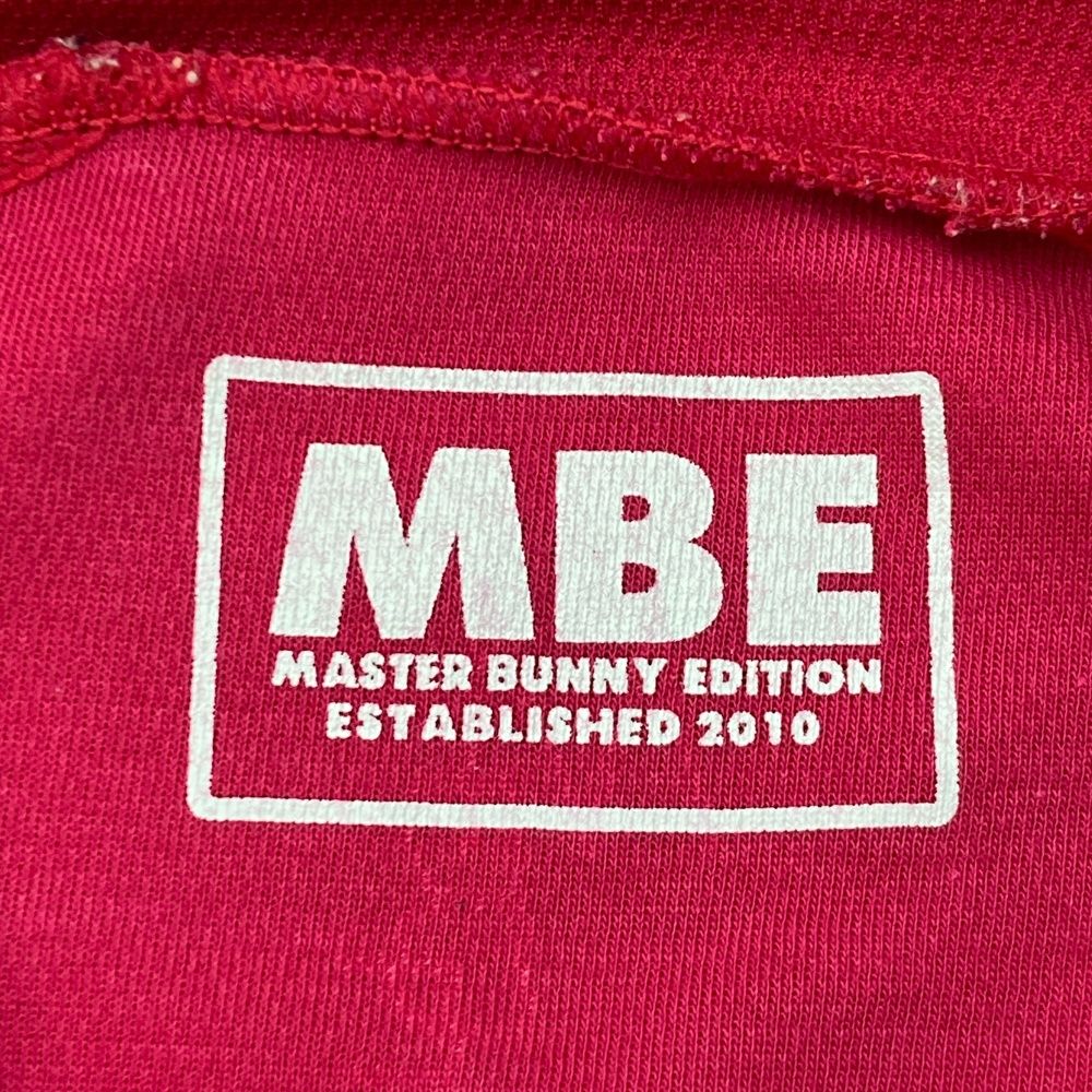 サイズ：6 MASTER BUNNY EDITION マスターバニーエディション  ハイネック 長袖Tシャツ  ピンク系 [240101491785] ゴルフウェア メンズ ストスト サイズ：6 MASTER BUNNY EDITION マスターバニーエディション