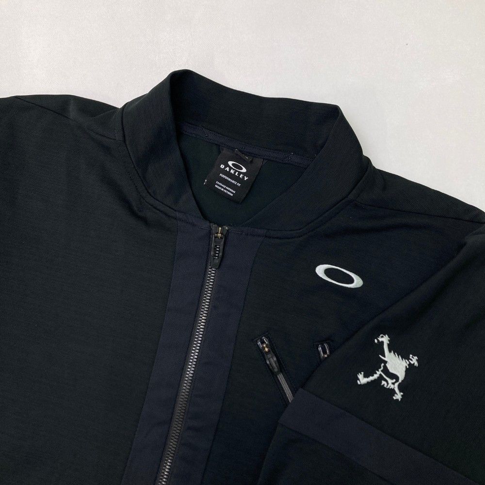 サイズ：M OAKLEY オークリー  ジップジャケット  ブラック系 [240101427636] ゴルフウェア メンズ ストスト サイズ：M OAKLEY オークリー ジップジャケット ブラック系