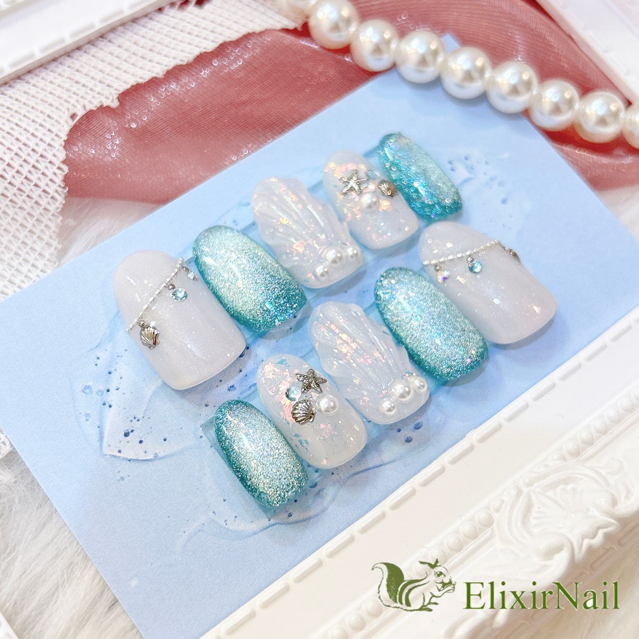 現品】ネイルチップ 白 水色 マーメイド マグネット - メルカリ