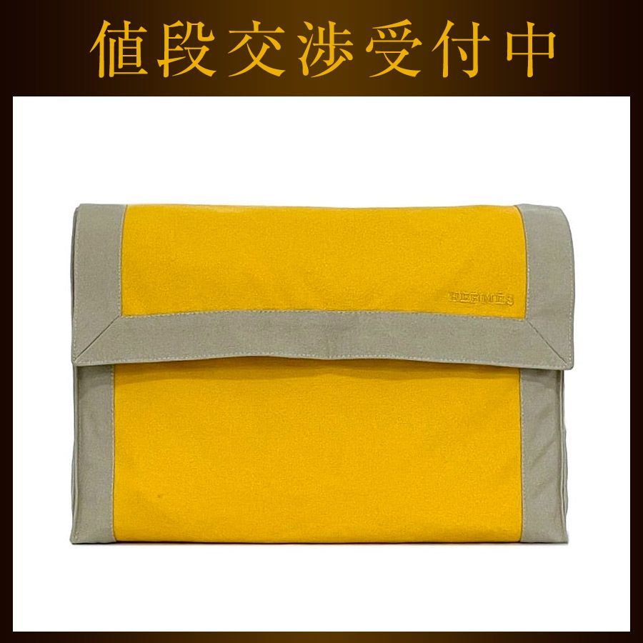 エルメス タピドセル キャンバス クラッチバッグ エルメス クラッチバッグ タピドセル イエロー ベージュ 美品