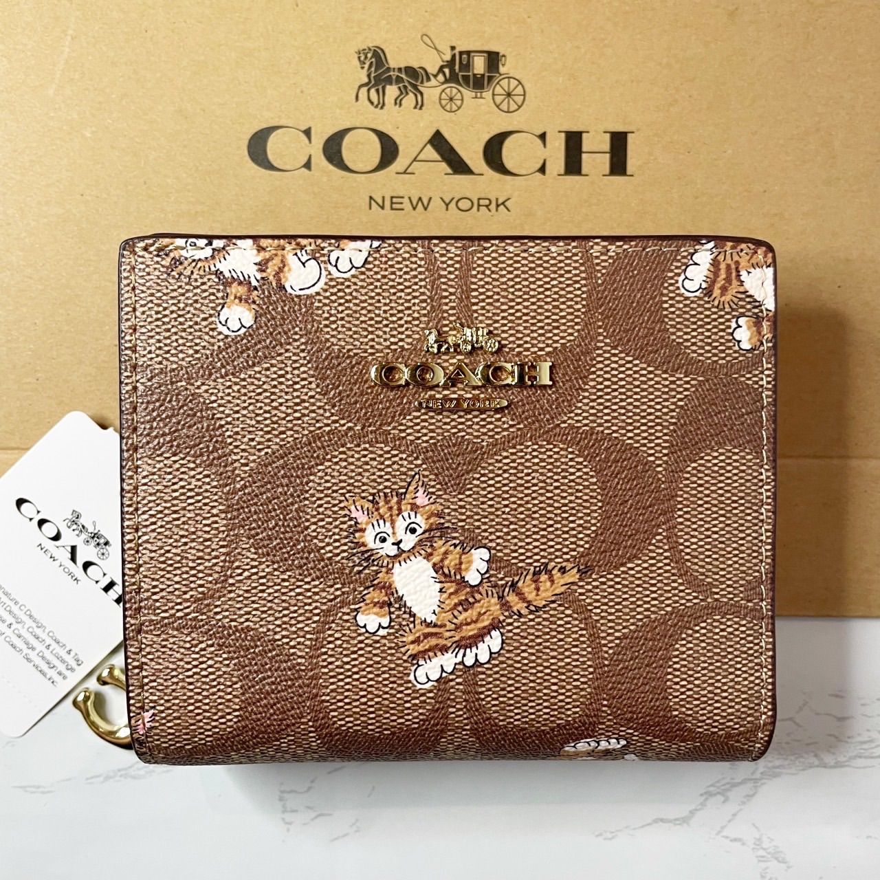 COACH シグネチャー 猫 キャット 二つ折り財布 - メルカリ