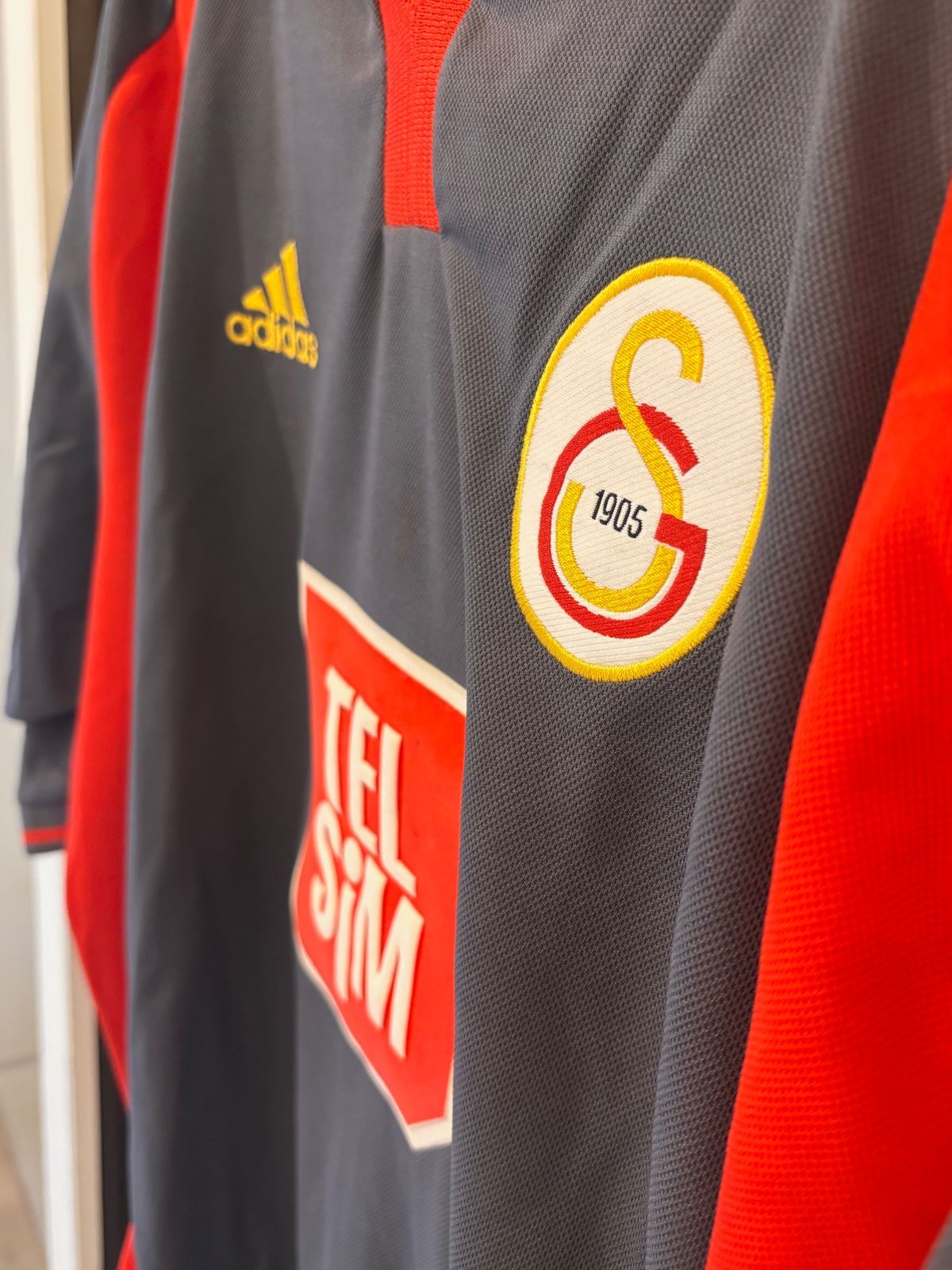 襟付きゲームシャツ 万国旗タグ