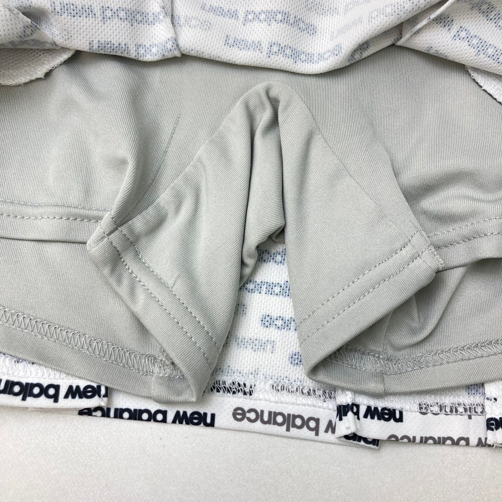 サイズ：2 NEW BALANCE GOLF ニューバランス 2023年モデル 中綿 フリルスカート  ブラック系 [240101496592] ゴルフウェア レディース ストスト ニューバランスゴルフ NB 【耐風保温】配色ライン裾フリル中綿
