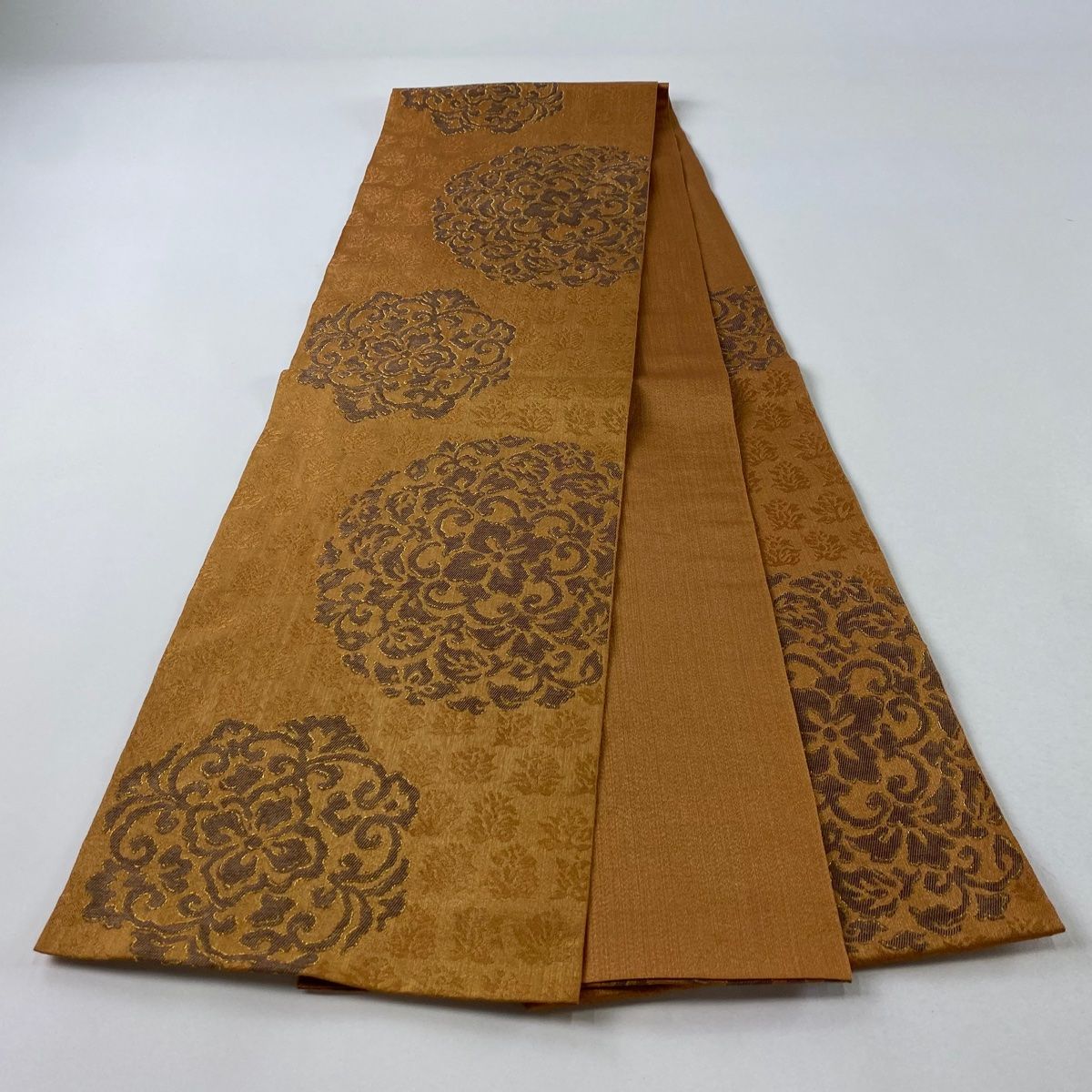 ムガシルク 金彩花唐草ライトベージュ全通柄 名古屋帯 (袋帯としても)極美品 袋帯 美品 秀品 樹下双獣文 華文 箔 裂取 オレンジ 全通 正絹 【