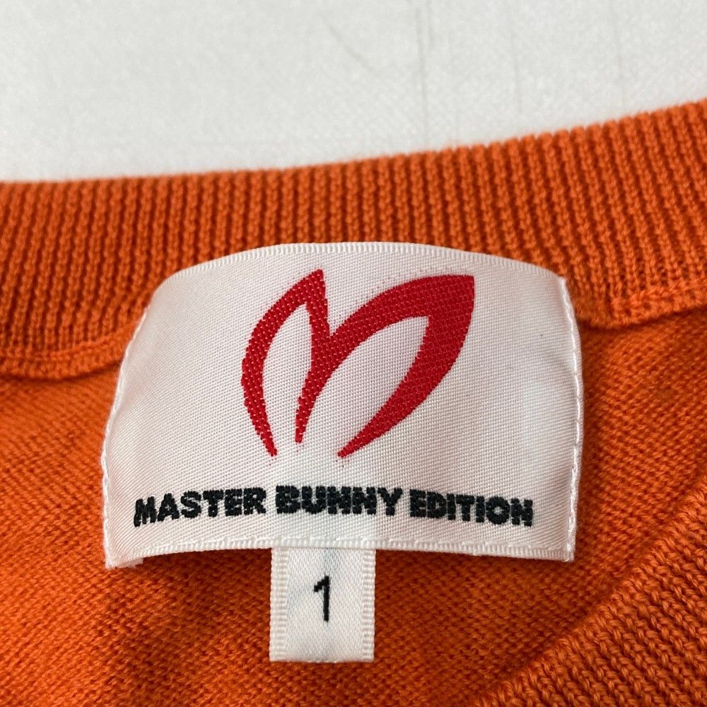 サイズ：1 MASTER BUNNY EDITION マスターバニーエディション  フロントロゴ 長袖ニットセーター  オレンジ系 [240101471871] ゴルフウェア レディース ストスト MASTER BUNNY EDITION マスターバニーエディション フロントロゴ