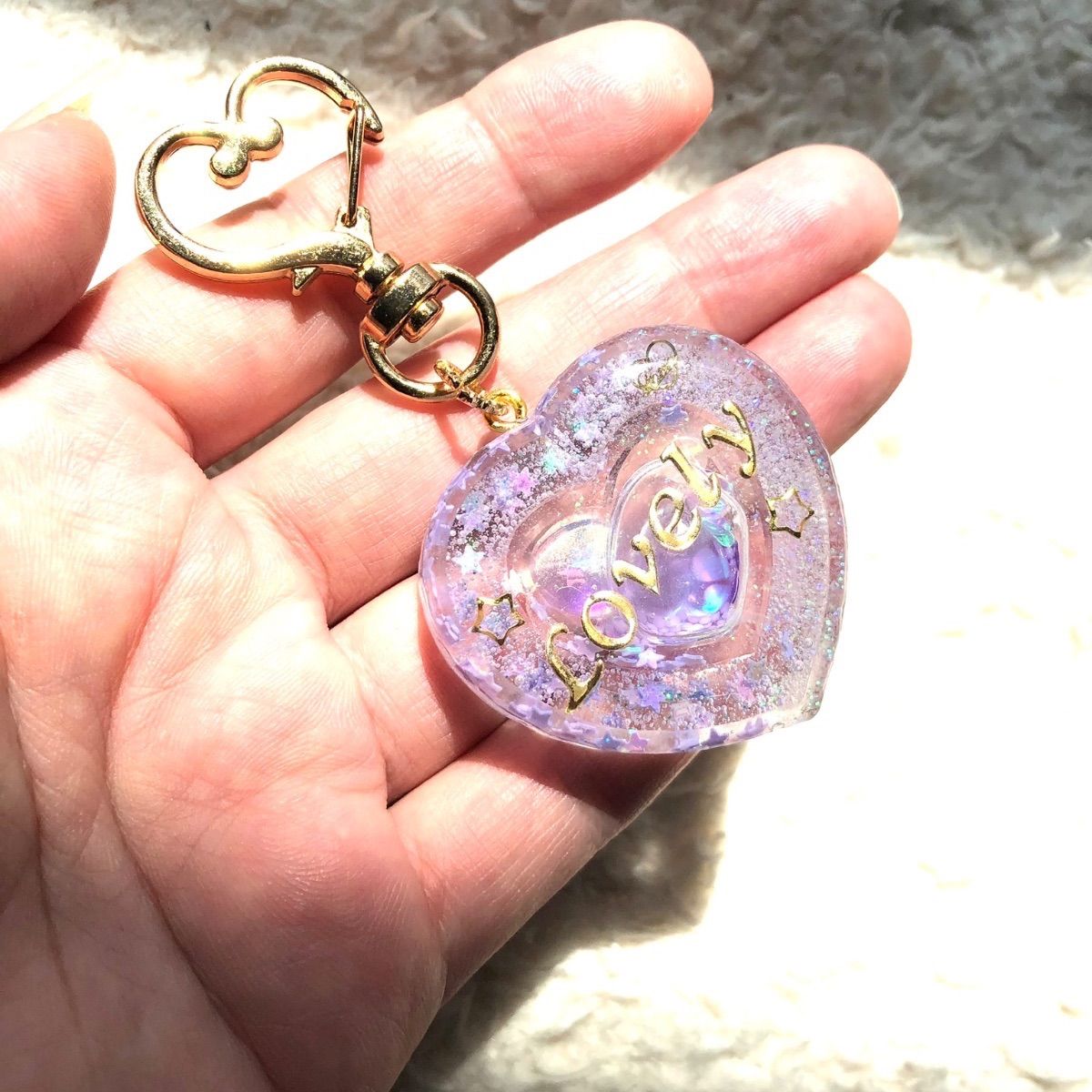 ダブルハートシェイカー❤︎キーホルダー ホワイトラメと星がキラキラ 中身はゆらゆら(~¯︶¯)~ Lovely メルカリShops