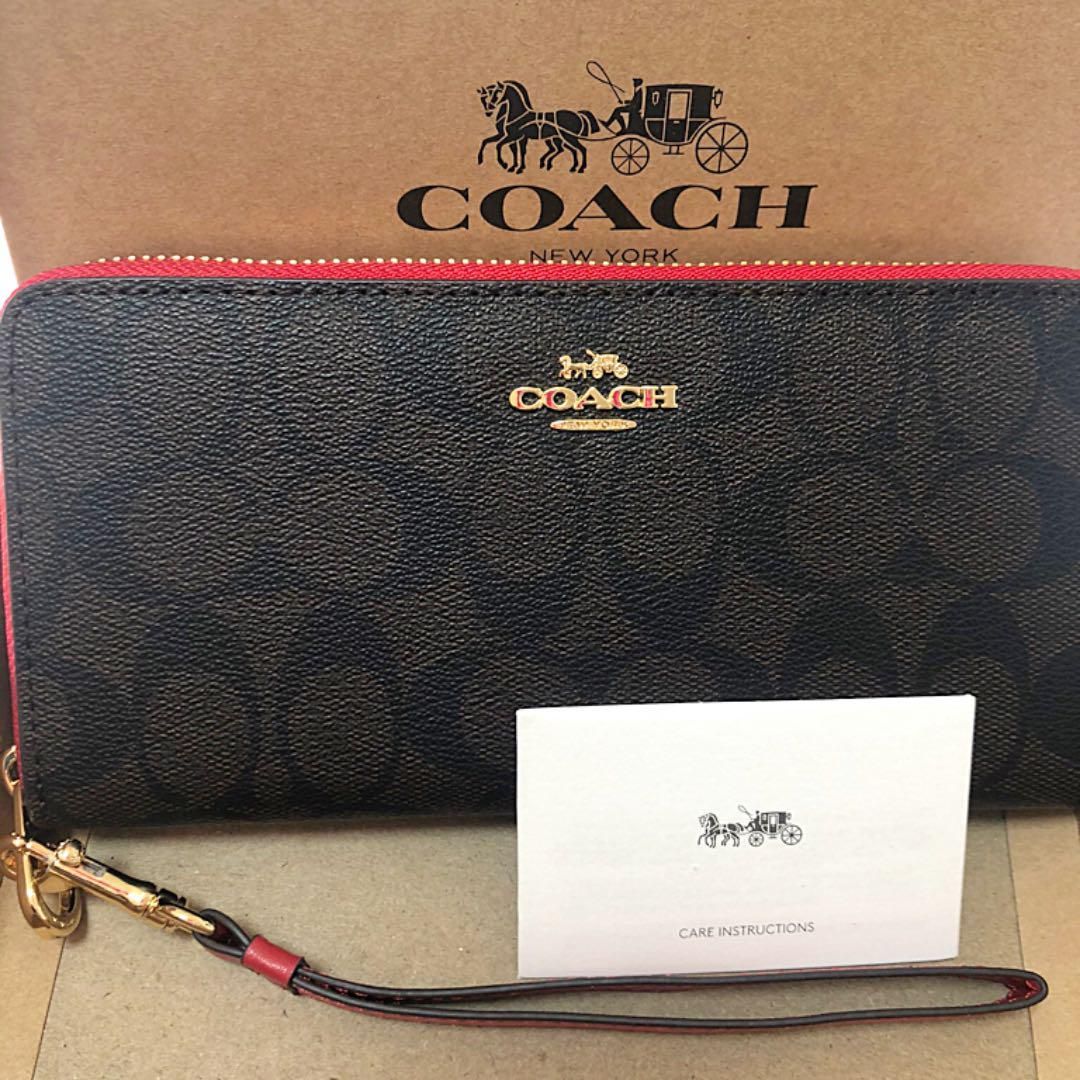 美品 長財布 レディースCOACHコーチストラップ付シグネチャー