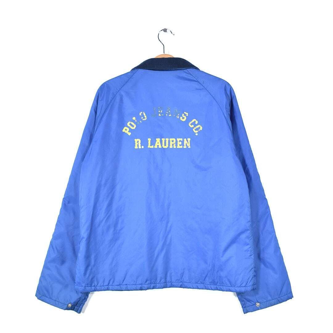 ポロジーンズ ラルフローレン ナイロンジャケット バックプリント 内フリース ブルー 青 英字プリント POLO JEANS RALPH LAUREN メンズL 古着 @DZ0596