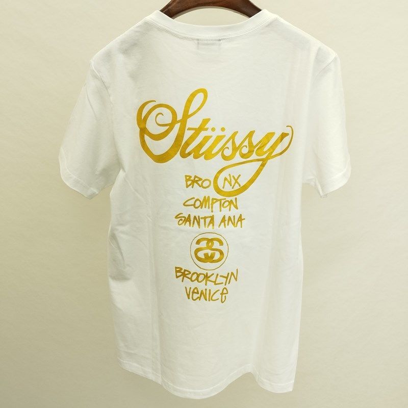 STUSSY ゴールドロゴプリントTシャツ S ホワイト 半袖 バックプリント ...