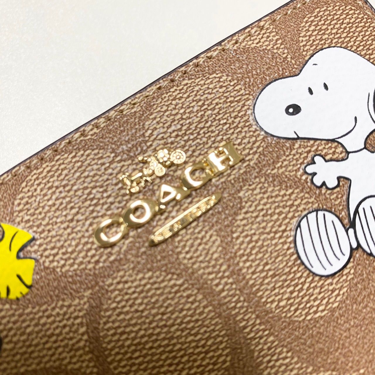 新品／未使用】COACH CE704 二つ折り ミニ財布 スヌーピー ウッド ...