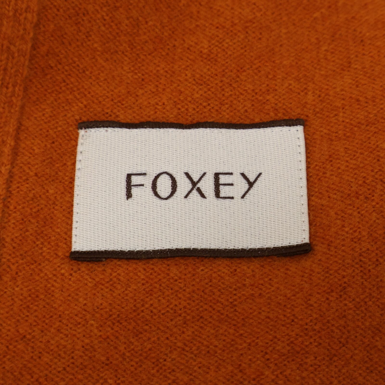 【新品未使用】FOXEY フード付きオレンジニットパーカー Mサイズ FOXEY フォクシー ﾌﾞﾗｳﾝ×ｵﾚﾝｼﾞ ｳｰﾙ ｽｸﾘﾌﾟﾄ ﾆｯﾄｼﾞｯﾌﾟﾊﾟｰｶｰ 38