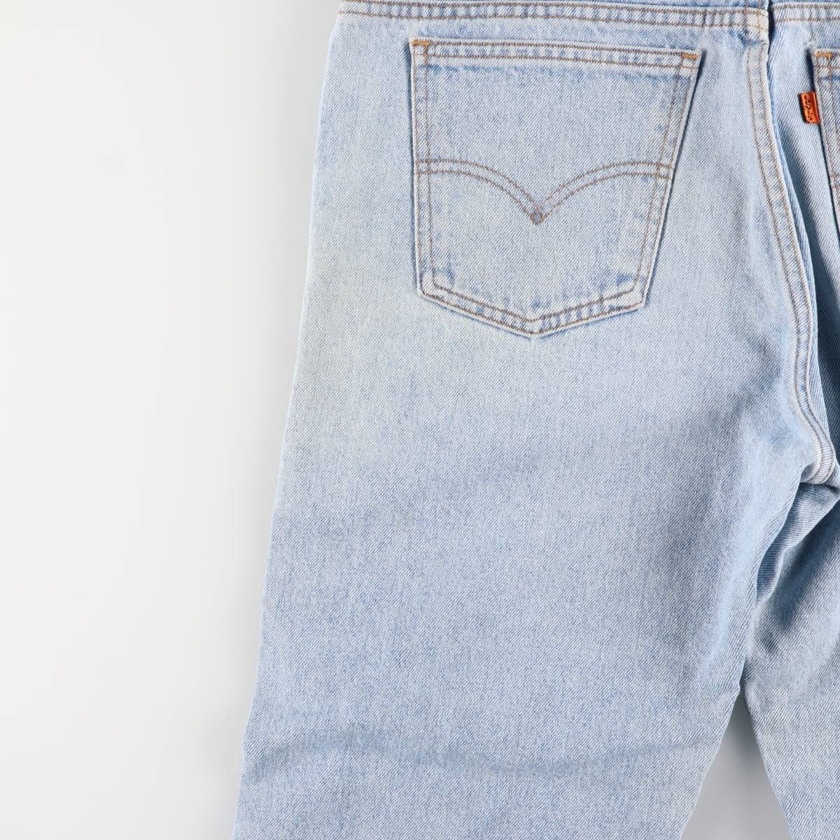 オレンジタブ テーパードデニムパンツ