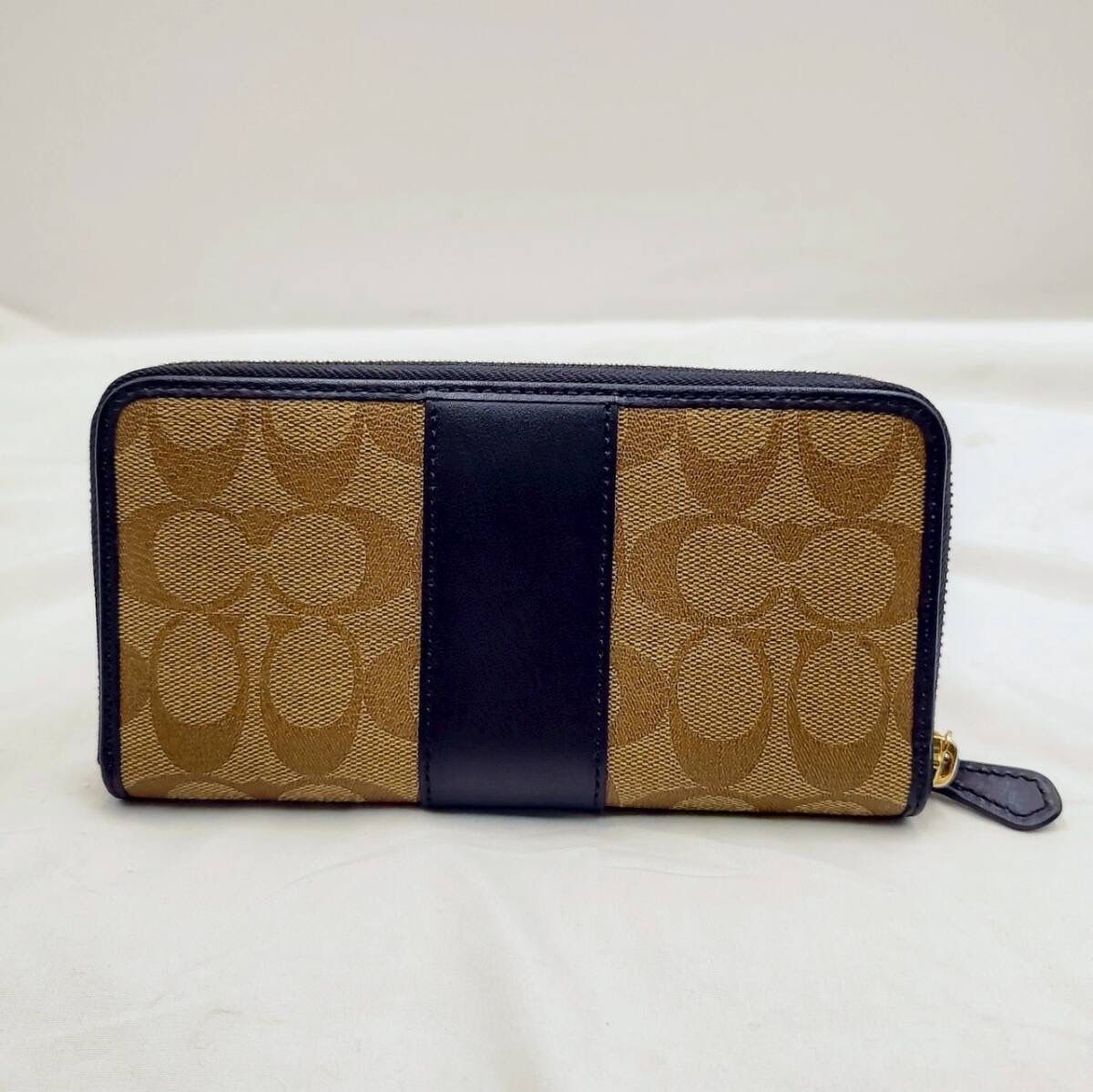 ラウンドジップ長財布 F54630