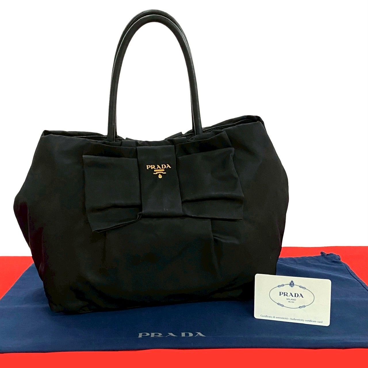 極 美品 カード付き PRADA プラダ ロゴ 金具 リボンモチーフ レザー 本 