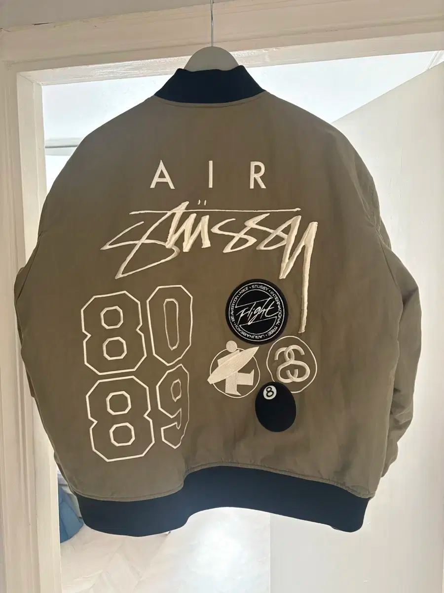 ナイキ×ストゥーシー リバーシブルジャケット オリーブ NIKE×sttusy 20240118070541-0.webp