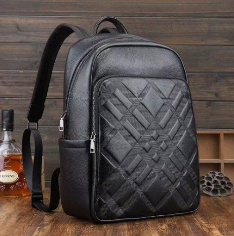 男性のランドセルの新型ビジネスのカジュアルなシンプルなコンピュータのリュックサック牛革の旅行バッグ出張リュックサック頭層