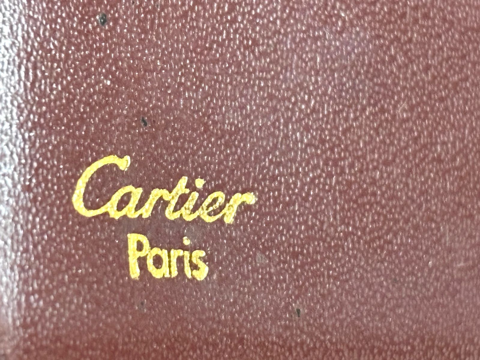 Cartier カルティエ　長財布　赤レザー　箱付き 箱 ギャランティカード付き Cartier バーガンディ 二つ折り財布