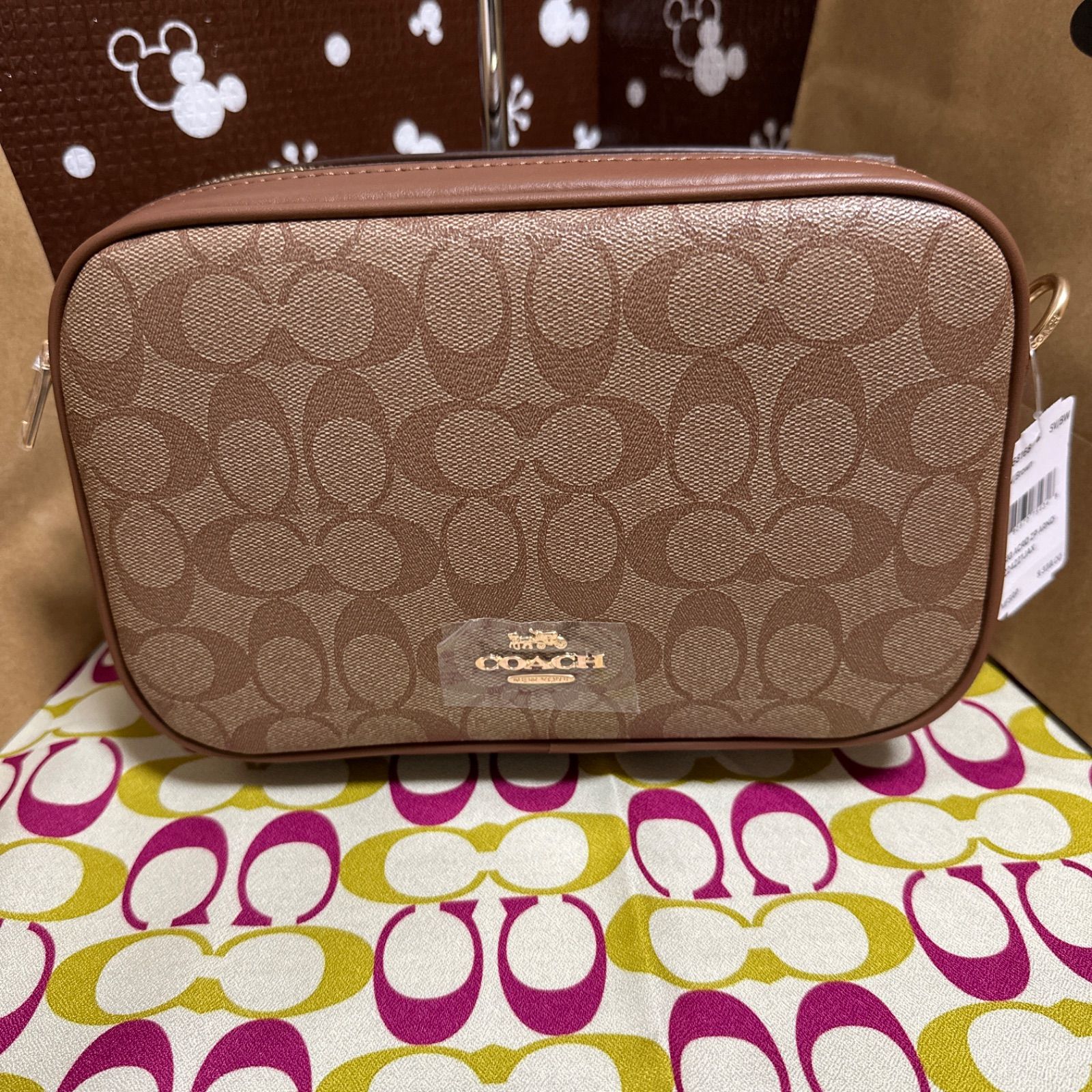 ピンクかわいい新品★COACH ショルダーバッグ PVCシグネチャー クロスボディF68168