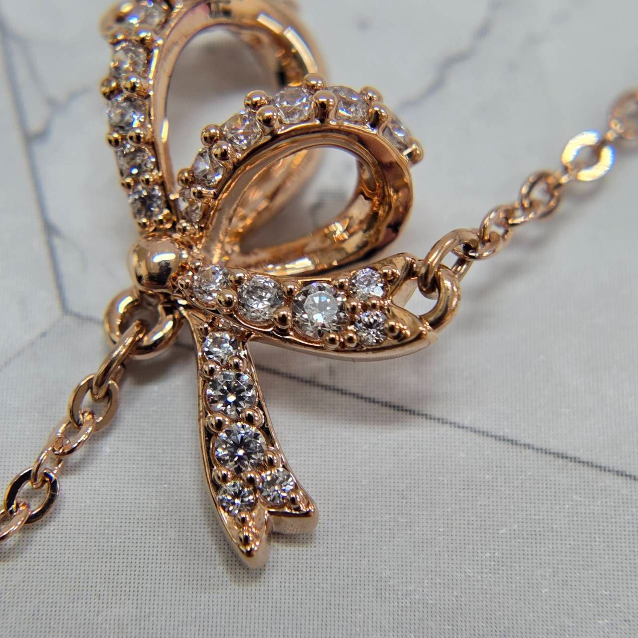 SWAROVSKI スワロフスキー リボンモチーフ ネックレス ピンクゴールド 