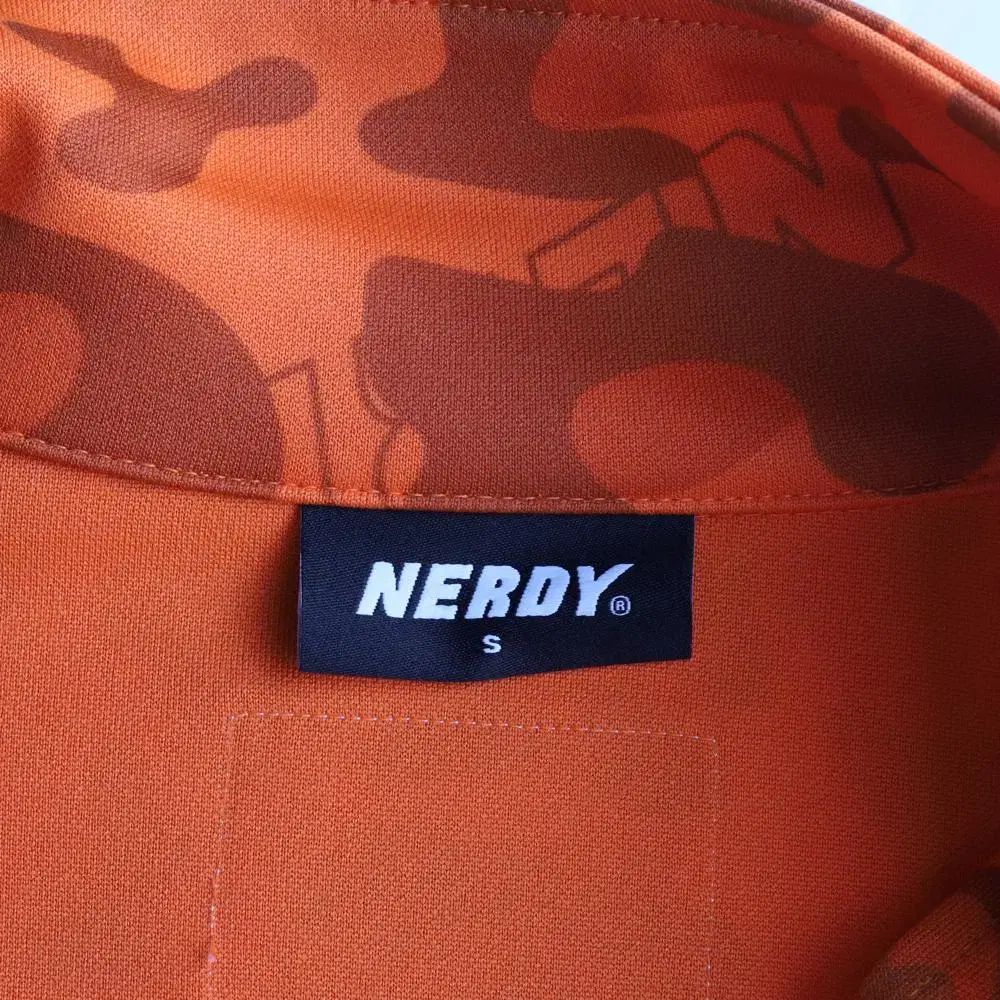 S NERDY(ノルディ) オレンジ レオパード トラックトップス