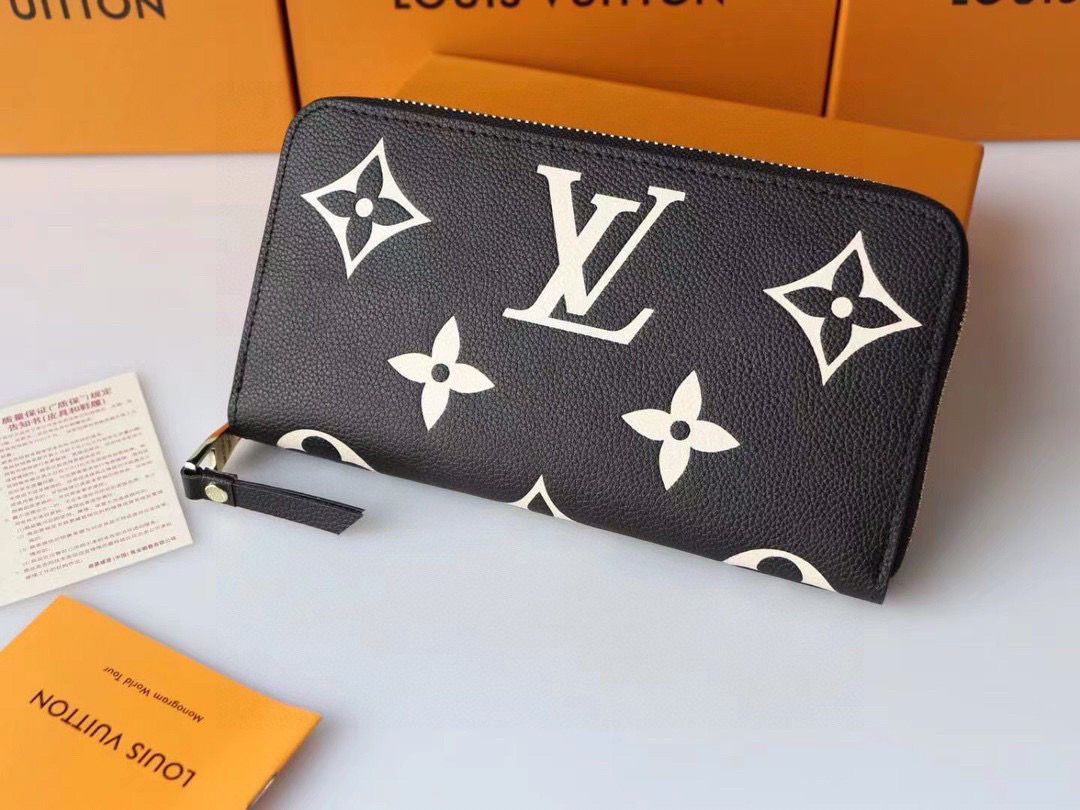 長財布LOUIS VUITTON 財布 男女兼用 かばんを手に持ちま