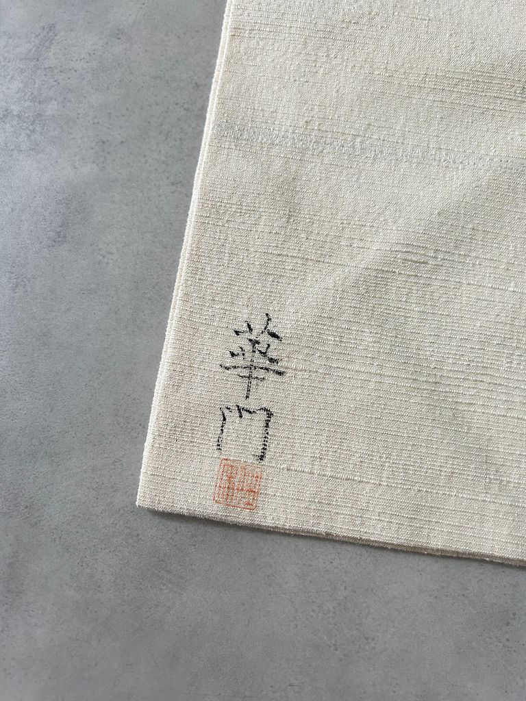 白地に薄紫の幾何学模様 紬の名古屋帯