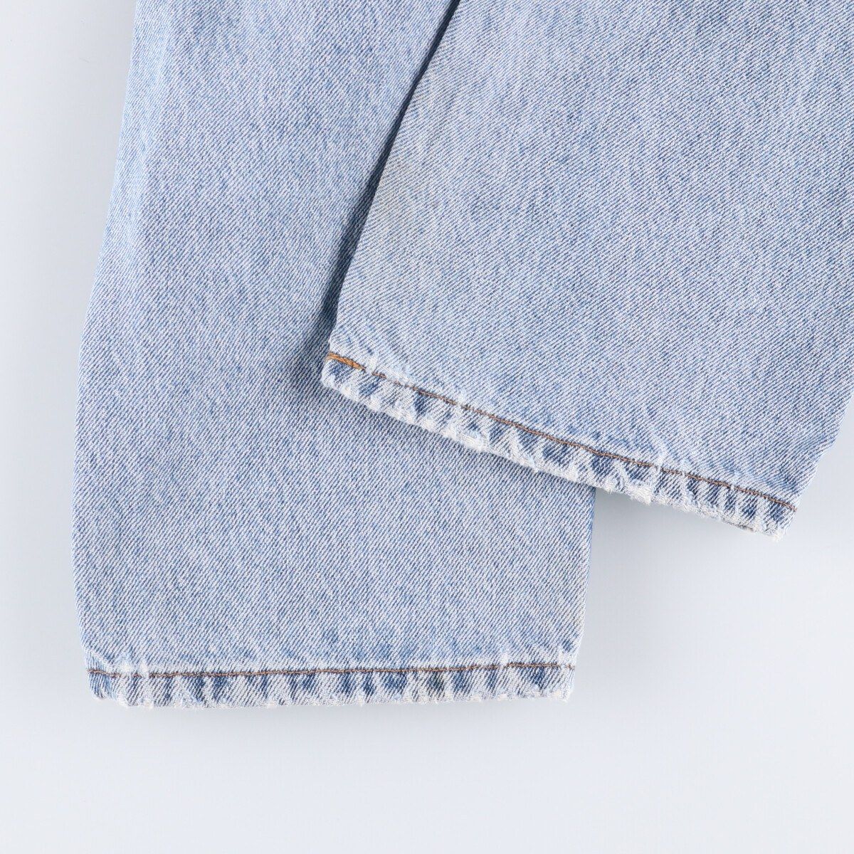 オレンジタブ テーパードデニムパンツ