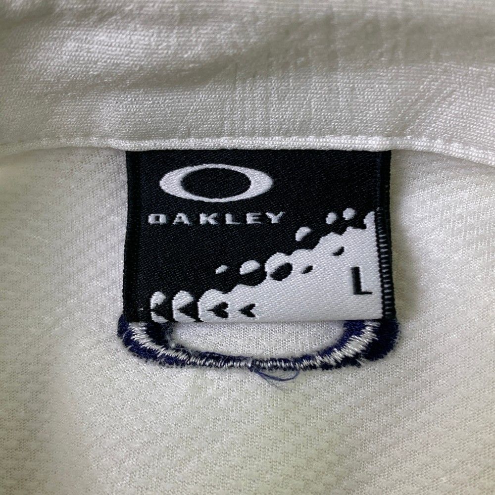 OAKLEY オークリー 半袖ポロシャツ ボタンダウン 総柄 ピンク系