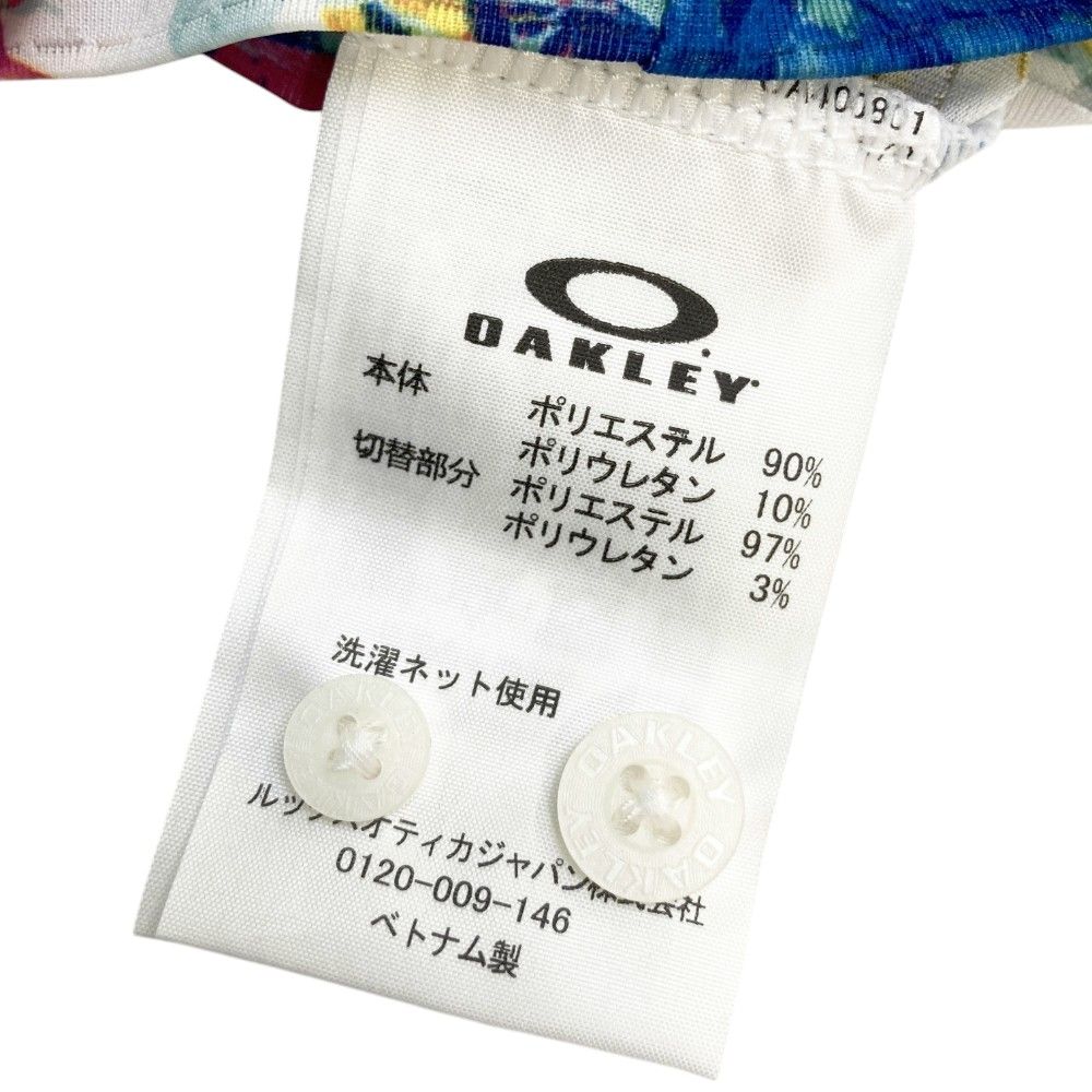 サイズ：L OAKLEY オークリー  半袖ポロシャツ 花柄 ホワイト系 [240101416957] ゴルフウェア メンズ ストスト サイズ：L OAKLEY オークリー 半袖ポロシャツ 花柄 ホワイト系