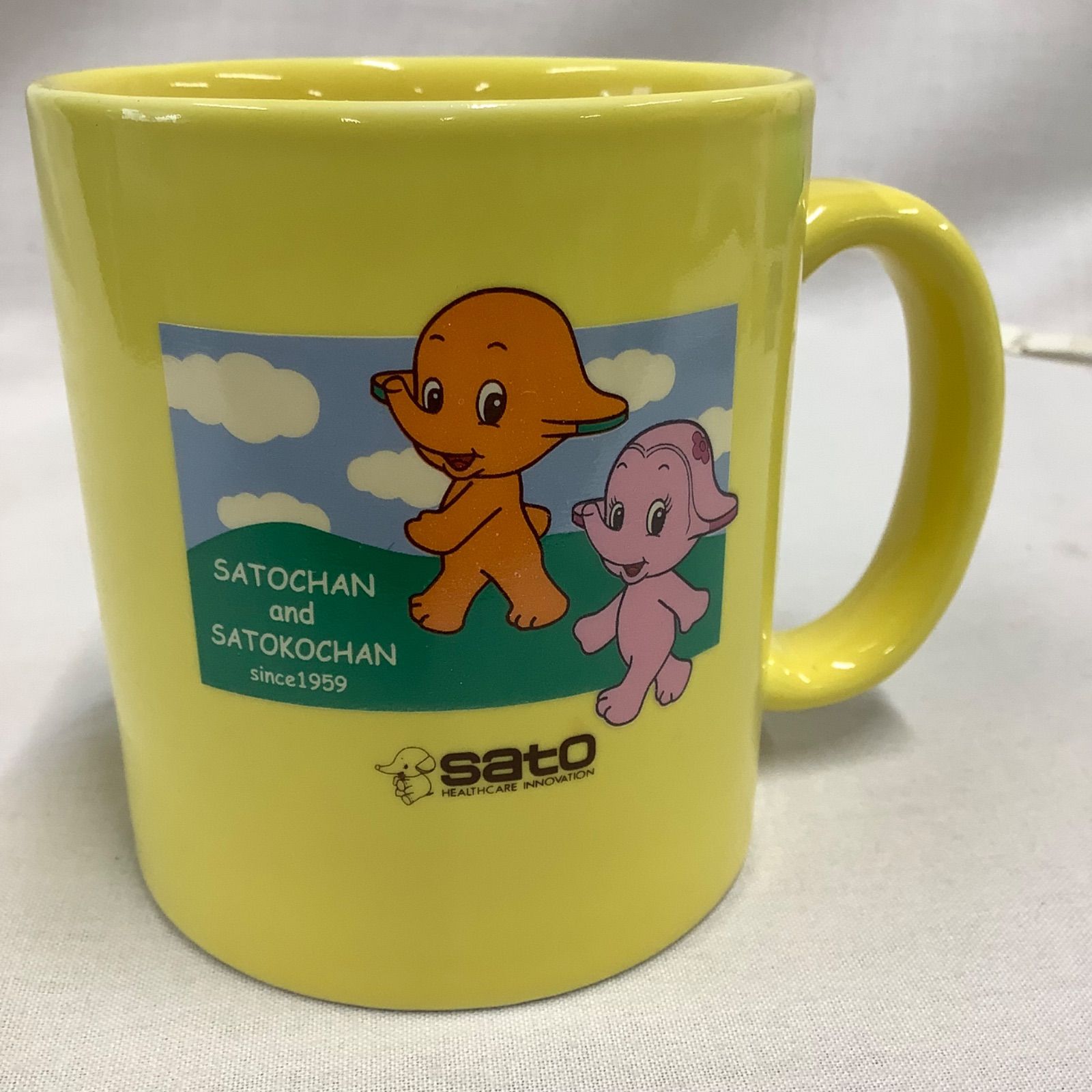 非売品】佐藤製薬 サトちゃん＆サトコちゃん マグカップ イエロー C555