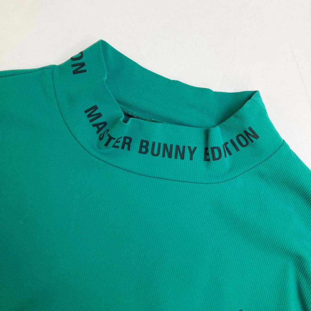 サイズ：5 MASTER BUNNY EDITION マスターバニーエディション  長袖ハイネックTシャツ  グリーン系 [240101465697] ゴルフウェア メンズ ストスト サイズ：5 MASTER BUNNY EDITION マスターバニーエディション