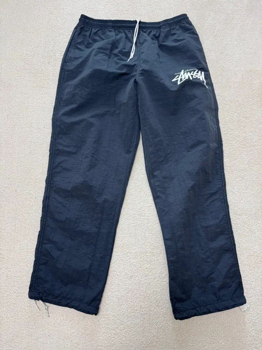 r*r様 stussy × NIKE ビーチパンツ オフノワール サイズM Nike x Stussy Beach Pants Off Noir(タグ付き) - メルカリ