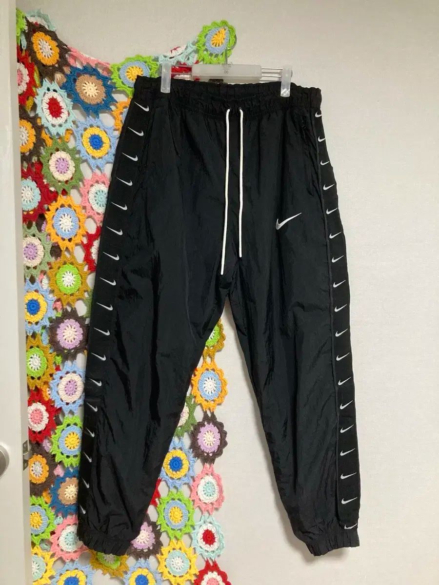 Nike ナイキ スウッシュ テーピング ワイド ウーブン パンツ トレーナー ジョガーパンツ